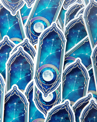 A bunch of moon and constellation stickers in blue and turqoise.