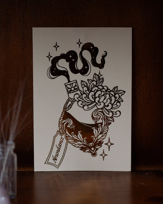 Abundance mini A5 print with floral design and text on a wooden shelf