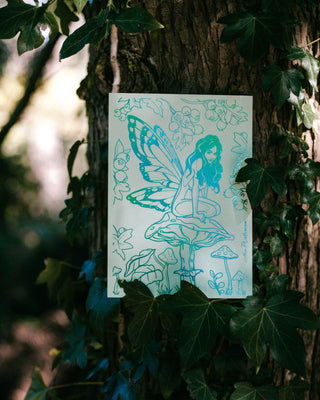 Illustration of a fairy on a mushroom in a forrest.