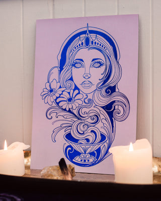 Artistic depiction of a woman's face with floral elements on a purple background, placed on a table with candles.