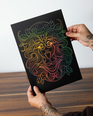 Lilith, Mother of Demons, foil art print in holographic gold on black card, the wild feminine with flowing lines and intricate detail, held in hand, handcrafted in Melbourne