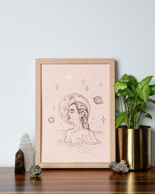 Moonlight Dip divine feminine art print in pumpkin foil on peach card, a woman gliding through water beneath the stars, handcrafted in Melbourne