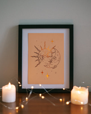 Once Upon A Kiss art print in pumpkin foil on peach card, framed and styled with candles and fairy lights