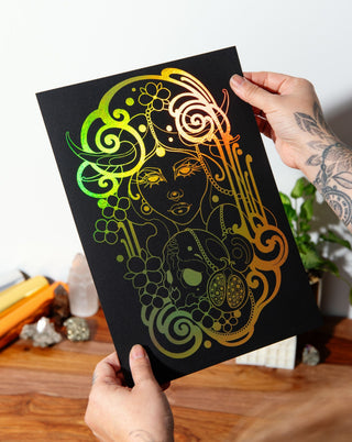 A print of Persephone, the Greek goddess of death and spring, with a black background and gold holographic foil details.