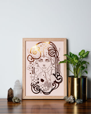 A print of Persephone, the Greek goddess of death and spring, with a black background and pumpkin foil details.