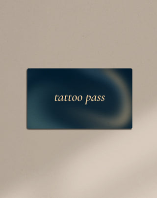 A card with the text tattoo pass in a navy blue background.